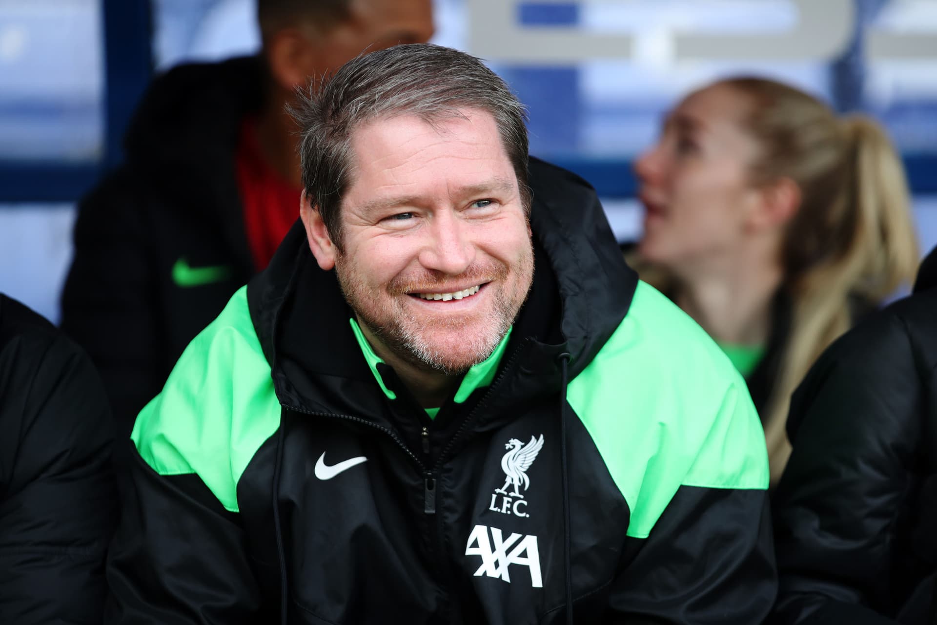 A photo of Matt Beard smiling in a Liverpool jacket